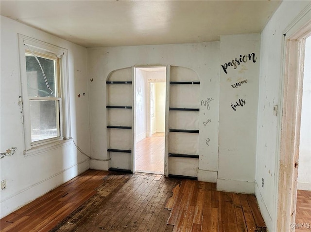 unfurnished room featuring dark hardwood / wood-style flooring