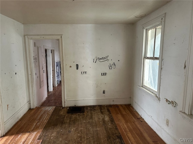 unfurnished room with dark hardwood / wood-style floors