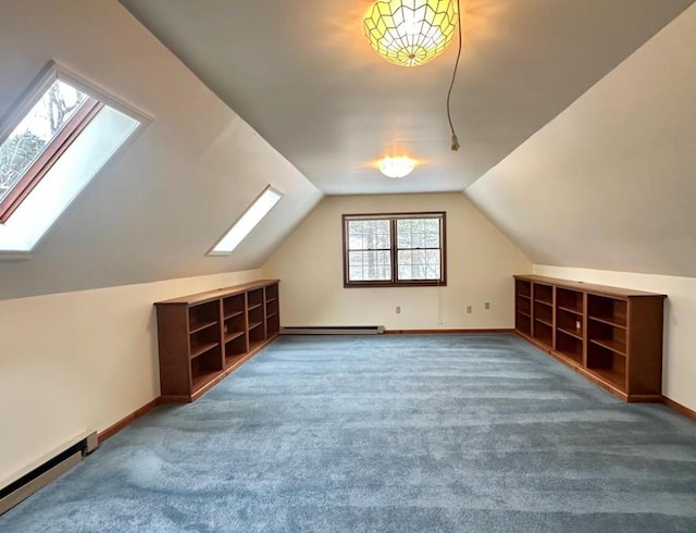 bonus room featuring carpet, a baseboard radiator, and lofted ceiling with skylight