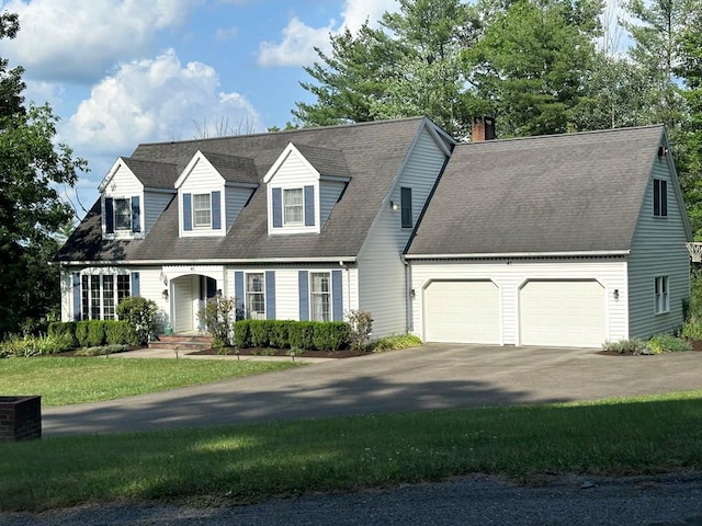 cape cod-style house with a front yard and a garage