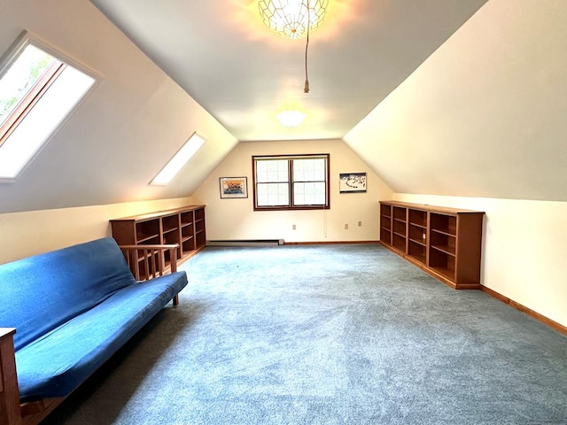 bonus room featuring vaulted ceiling with skylight, a baseboard heating unit, and carpet floors