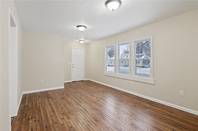 spare room featuring hardwood / wood-style flooring