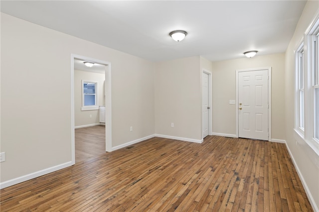 empty room featuring hardwood / wood-style flooring