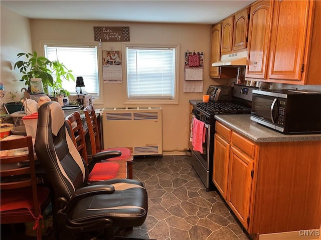 kitchen featuring appliances with stainless steel finishes and radiator