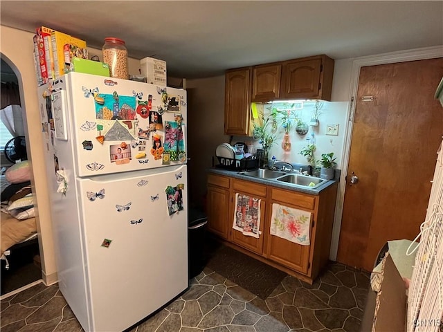 kitchen with white refrigerator and sink