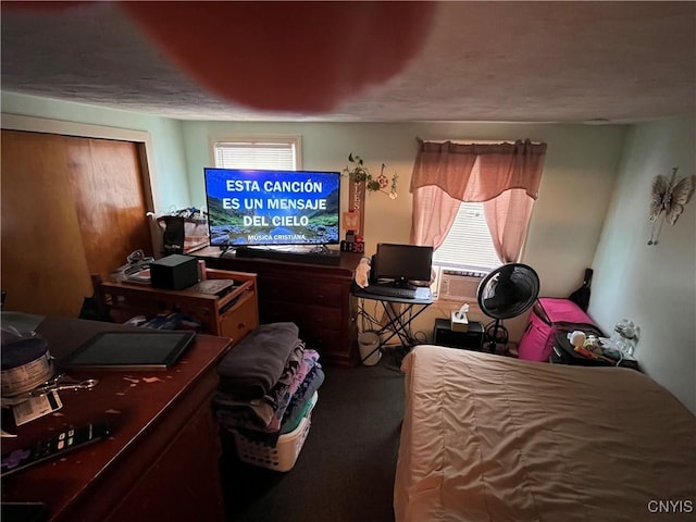 bedroom featuring carpet flooring and multiple windows