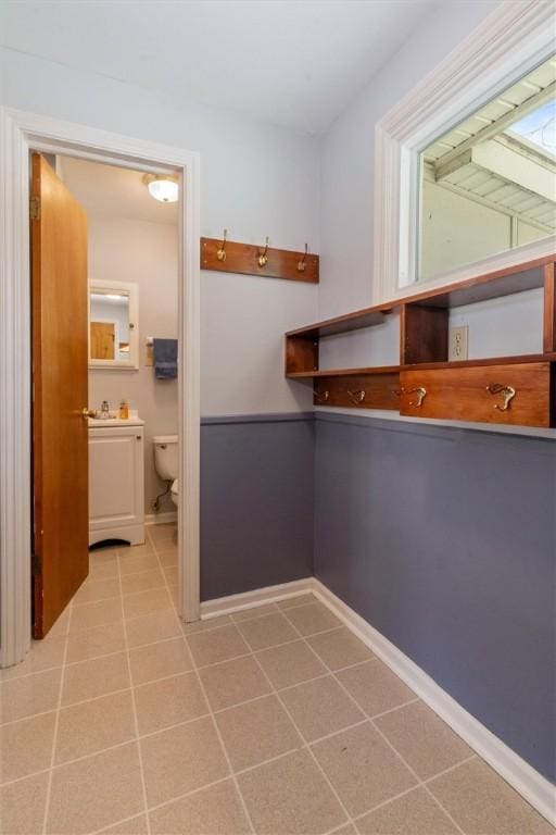 laundry room with light tile patterned floors