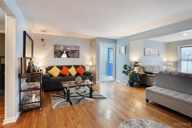 living room with light hardwood / wood-style flooring