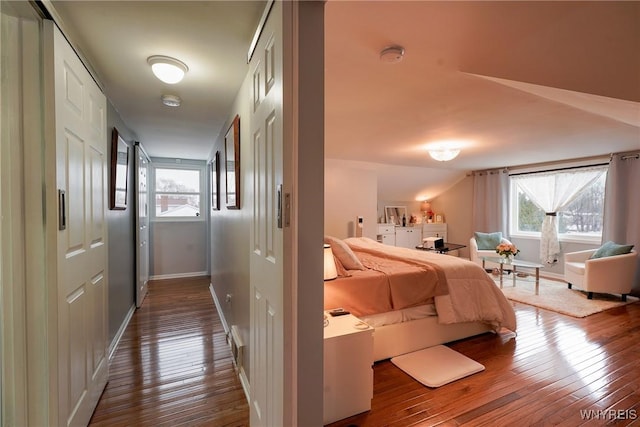 bedroom with hardwood / wood-style floors