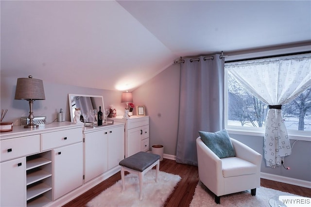 sitting room featuring vaulted ceiling and hardwood / wood-style floors