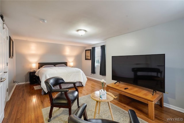 bedroom with wood-type flooring