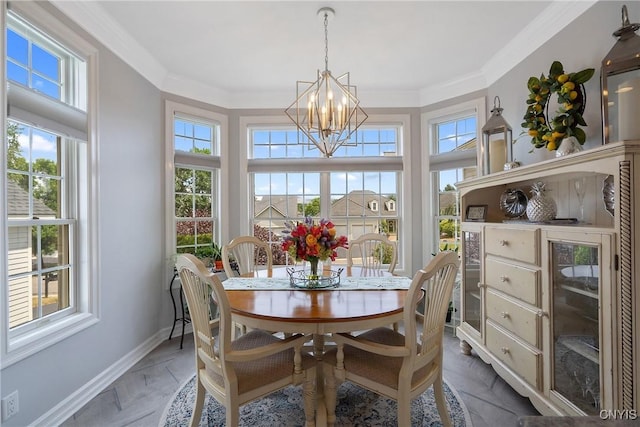 dining space featuring crown molding, a wealth of natural light, and an inviting chandelier