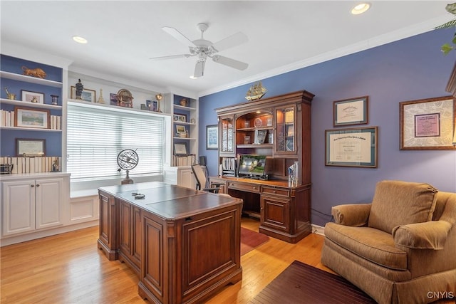 office space featuring light wood-type flooring, ornamental molding, and ceiling fan