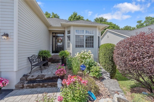 property entrance with a patio