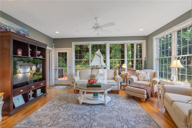 sunroom / solarium with ceiling fan