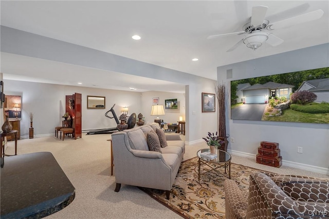 carpeted living room featuring ceiling fan