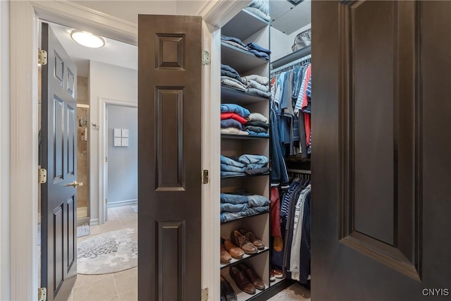 spacious closet with light tile patterned flooring