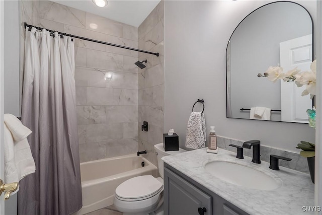 full bathroom featuring toilet, vanity, and shower / tub combo