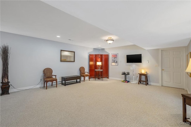 living area featuring light carpet