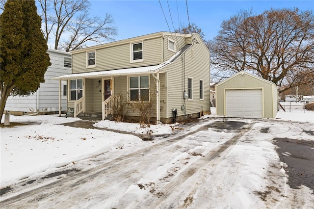 view of front property featuring a garage and an outdoor structure