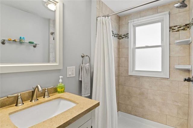 bathroom with vanity and walk in shower