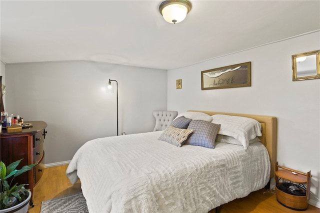 bedroom with hardwood / wood-style flooring