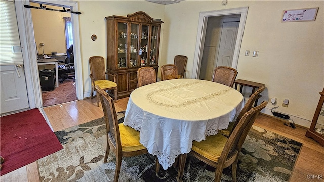 dining room with hardwood / wood-style flooring