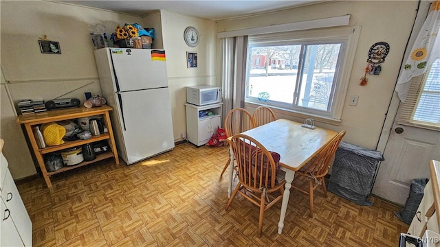 dining room featuring light parquet flooring