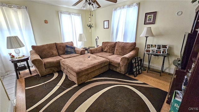 living room with hardwood / wood-style flooring and ceiling fan