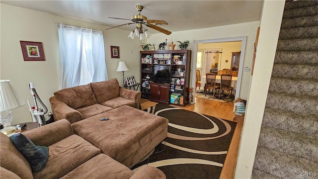 living room with ceiling fan and wood-type flooring