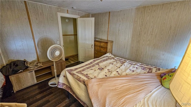 bedroom with dark hardwood / wood-style floors