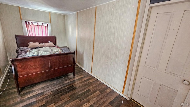 bedroom featuring dark wood-type flooring