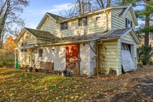 view of side of property with a garage