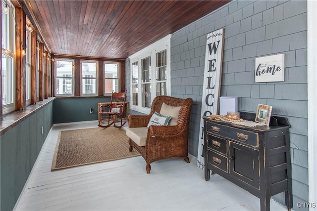 sunroom featuring wood ceiling