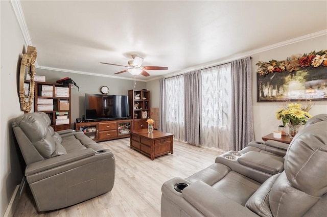 living room with ornamental molding, ceiling fan, and light wood-type flooring