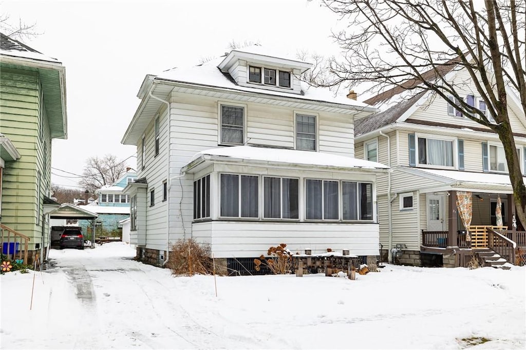 view of front property with a sunroom