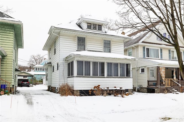 view of front property with a sunroom