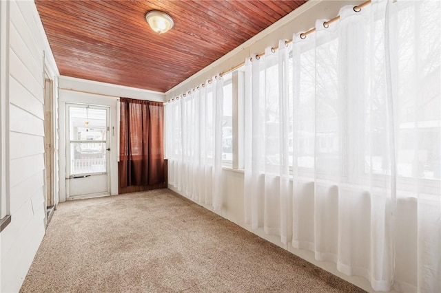 unfurnished sunroom with wooden ceiling