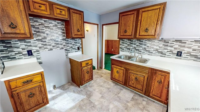 kitchen featuring sink and backsplash