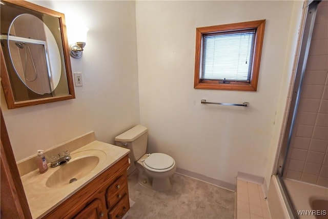 full bathroom featuring vanity, combined bath / shower with glass door, tile patterned floors, and toilet