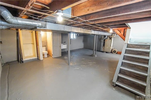 basement with sink and heating unit