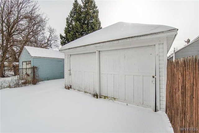 view of snow covered garage