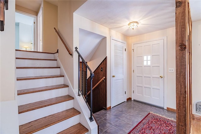 foyer with tile patterned flooring