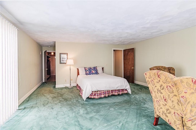 bedroom featuring a closet and dark colored carpet