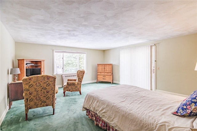 carpeted bedroom featuring a textured ceiling