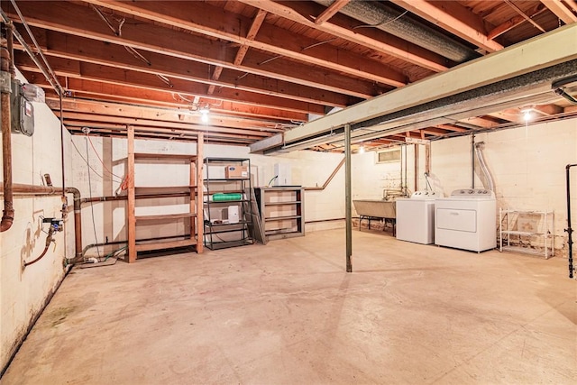 basement with washing machine and clothes dryer