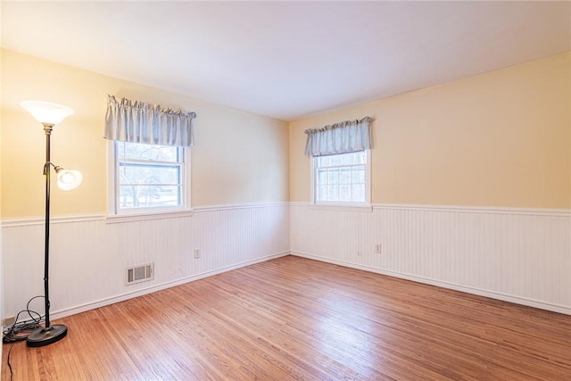 empty room with hardwood / wood-style floors