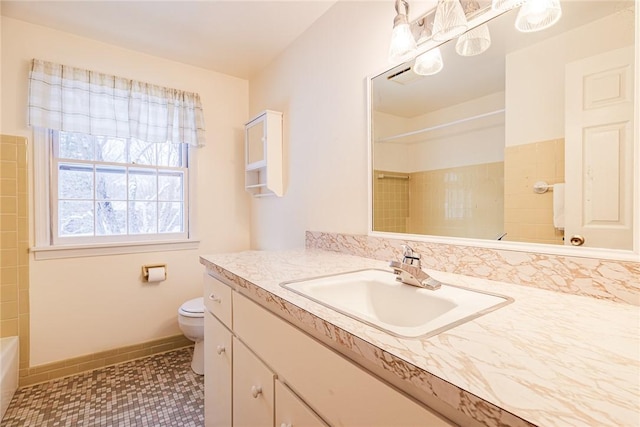 bathroom with vanity and toilet