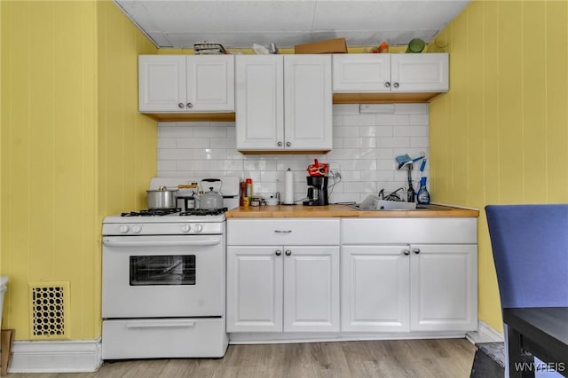 547 Potomac Ave, Buffalo, NY 14222 - kitchen featuring white cabinetry and white range with gas cooktop