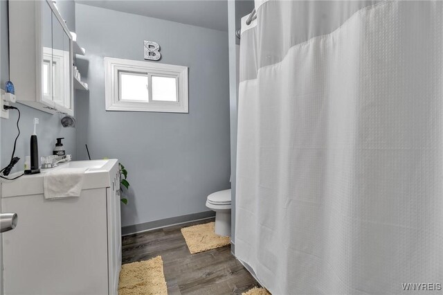 547 Potomac Ave, Buffalo, NY 14222 - bathroom with vanity, hardwood / wood-style flooring, and toilet